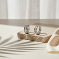 Murmure — 1.8 Ct Moissanite Huggie Earrings in Sterling Silver by Trendsi